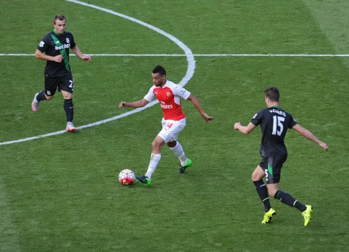 Framed Print : Coquelin Stands Firm Against Shaqiri and van Ginkel's Challenge in Arsenal vs Stoke Clash Framed Print : Coquelin Stands Firm Against Shaqiri and van Ginkel's Challenge in Arsenal vs Stoke Clash