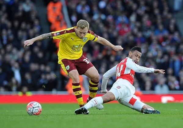 Coquelin vs. Arfield: Intense Tackle in Arsenal's FA Cup Battle Against Burnley