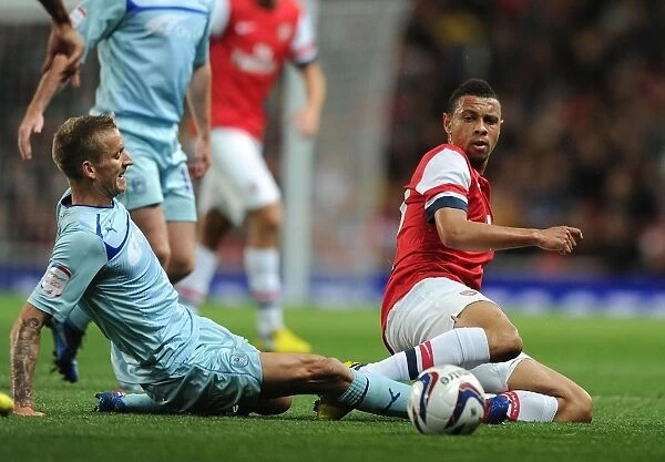 Coquelin vs Baker: Battle for the Ball in Arsenal's Capital One Cup Victory
