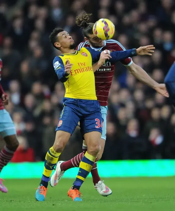 Framed Print : Coquelin vs. Carroll: Intense Battle in West Ham United vs. Arsenal Premier League Clash Framed Print : Coquelin vs. Carroll: Intense Battle in West Ham United vs. Arsenal Premier League Clash