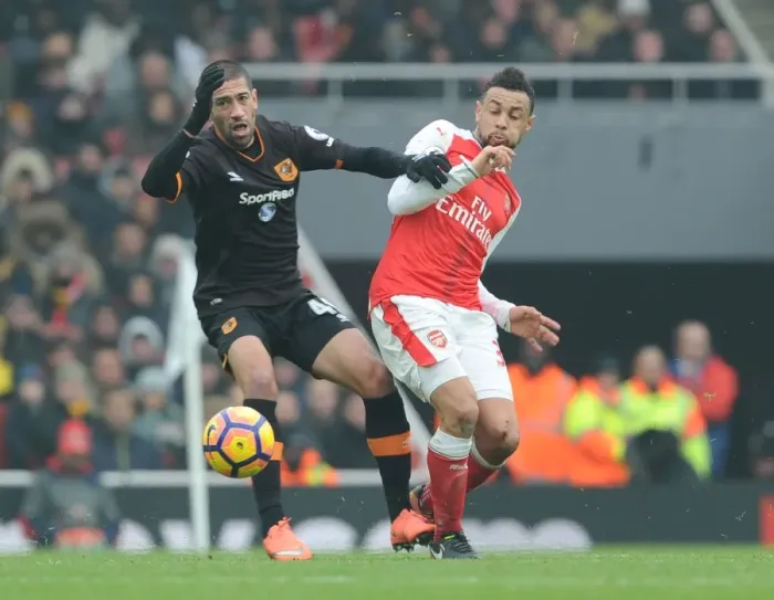 Framed Print : Coquelin vs Evandoro: A Premier League Battle at Emirates Stadium Framed Print : Coquelin vs Evandoro: A Premier League Battle at Emirates Stadium
