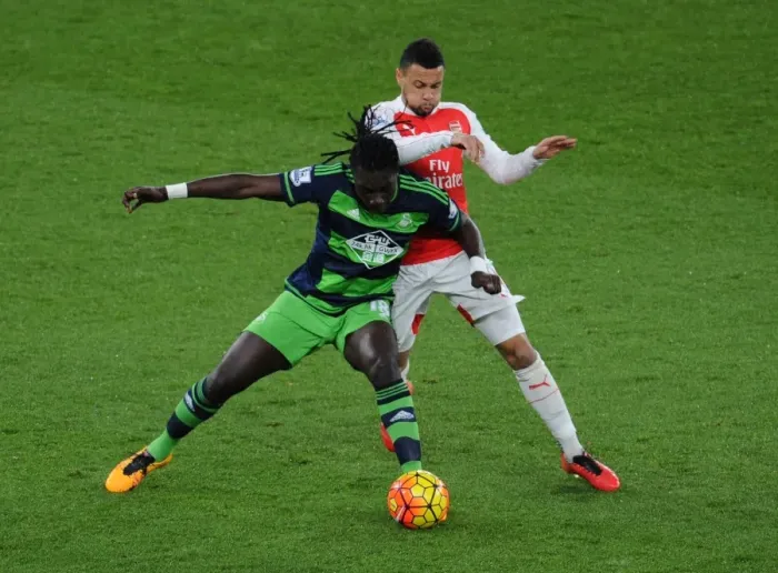 Framed Print : Coquelin vs Gomis: A Premier League Battle at Emirates Stadium - Arsenal vs Swansea City