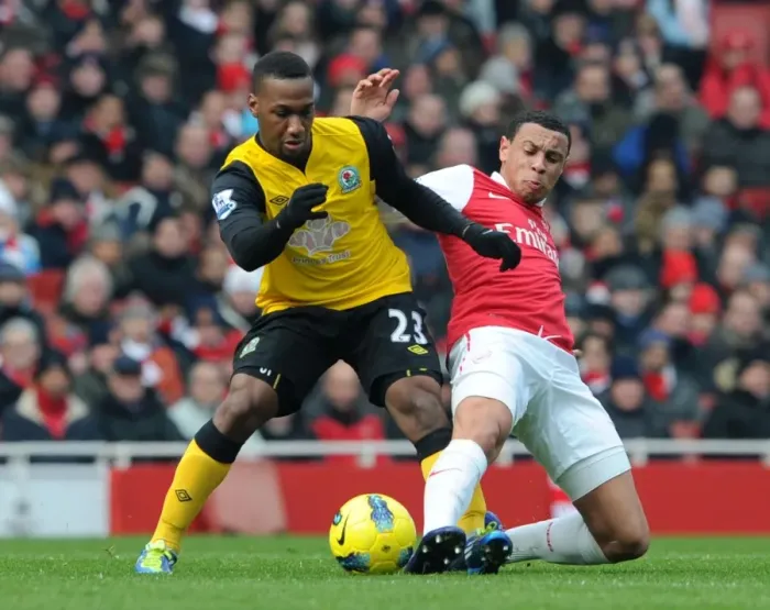 Framed Print : Coquelin vs. Hoilett: A Premier League Tackle Battle at Emirates Stadium