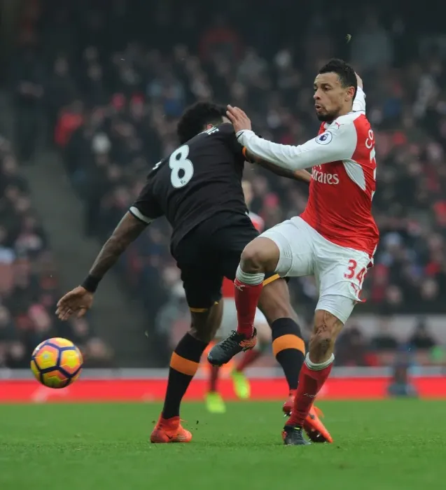 Framed Print : Coquelin vs Huddlestone: A Premier League Battle at Emirates Stadium Framed Print : Coquelin vs Huddlestone: A Premier League Battle at Emirates Stadium