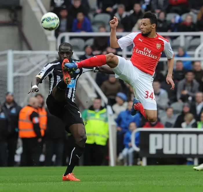 Framed Print : Coquelin vs Sissoko: Intense Battle in Newcastle United vs Arsenal Premier League Clash
