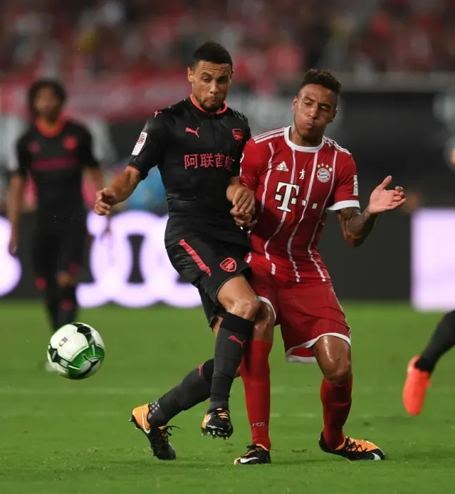 Framed Print : Coquelin vs. Tolisso: Battle in Shanghai - Bayern Munich vs. Arsenal Pre-Season Clash Framed Print : Coquelin vs. Tolisso: Battle in Shanghai - Bayern Munich vs. Arsenal Pre-Season Clash