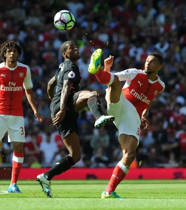 Framed Print : Coquelin vs. Wijnaldum: A Premier League Battle at Emirates Stadium (2016-17) Framed Print : Coquelin vs. Wijnaldum: A Premier League Battle at Emirates Stadium (2016-17)