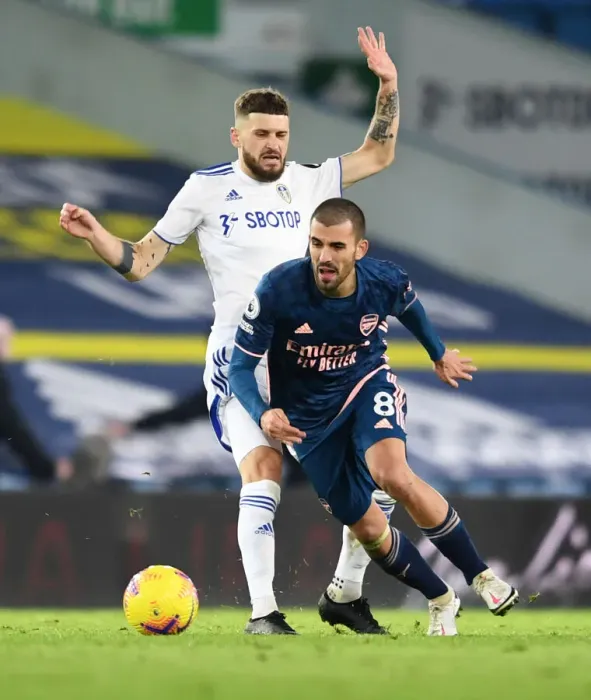 Framed Print : Dani Ceballos vs Mateusz Klich: Intense Battle in Leeds United vs Arsenal Premier League Clash