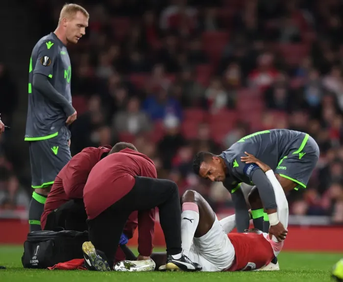 Framed Print : Danny Welbeck Consoled by Nani Amid Injury: Arsenal vs. Sporting CP, UEFA Europa League 2018-19