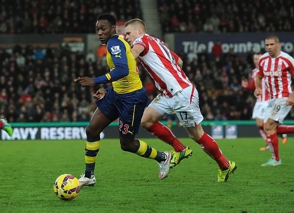 Danny Welbeck Dashes Past Ryan Shawcross: A Pivotal Moment from Stoke City vs. Arsenal (2014-15)