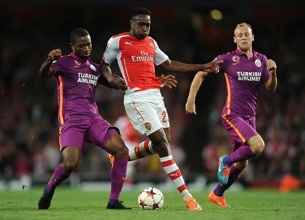 Danny Welbeck Stands Firm Against Galatasaray's Aurelien Chedjou and Semih Kaya in Intense Arsenal-Galatasaray Champions League Showdown