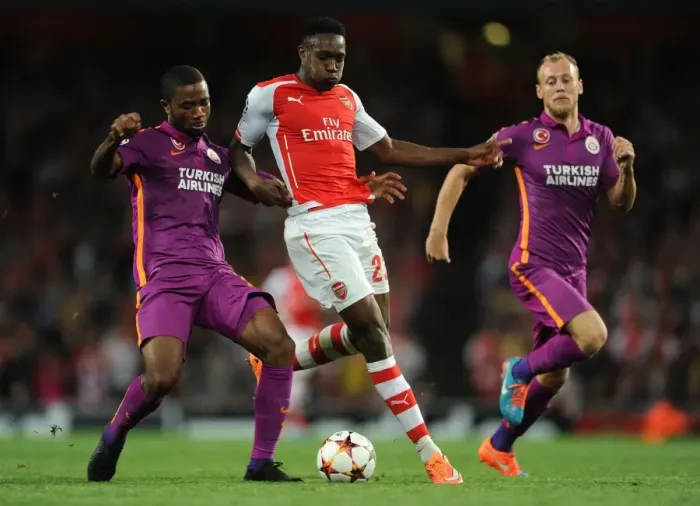 Framed Print : Danny Welbeck Stands Firm Against Galatasaray's Aurelien Chedjou and Semih Kaya in Intense Arsenal-Galatasaray Champions League Showdown Framed Print : Danny Welbeck Stands Firm Against Galatasaray's Aurelien Chedjou and Semih Kaya in Intense Arsenal-Galatasaray Champions League Showdown