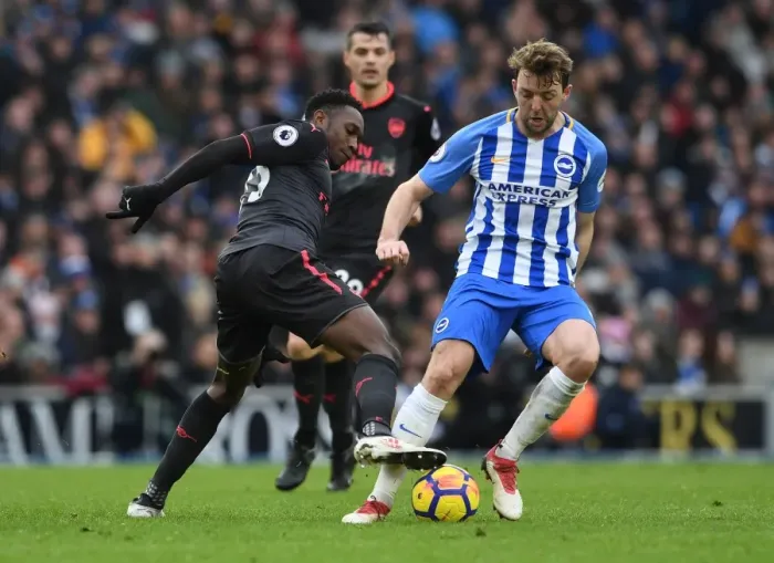 Framed Print : Danny Welbeck vs Dale Stephens: Intense Battle in Brighton and Hove Albion vs Arsenal Premier League Clash