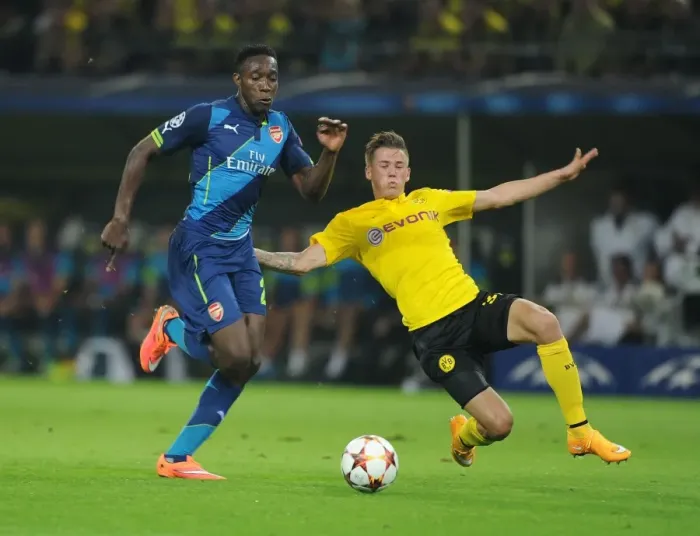 Framed Print : Danny Welbeck vs. Eric Durm: A Battle in the UEFA Champions League between Borussia Dortmund and Arsenal
