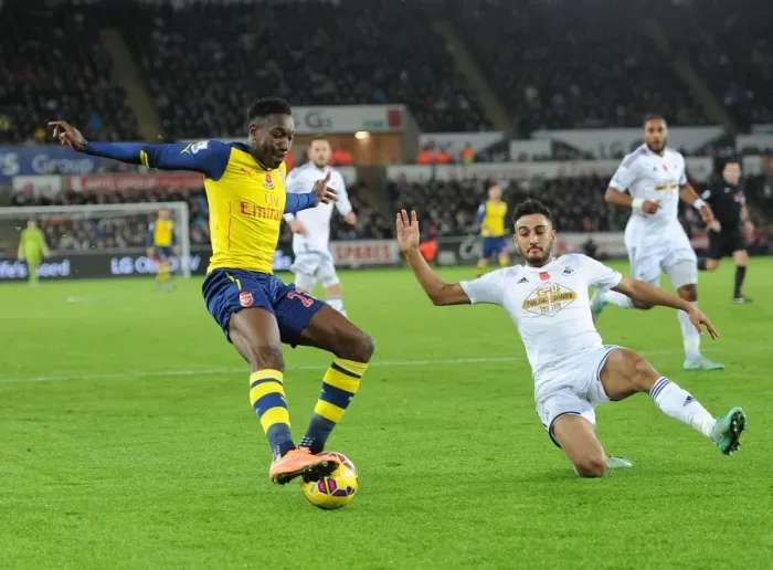 Framed Print : Danny Welbeck vs. Neil Taylor: Intense Battle at Swansea's Liberty Stadium (Arsenal vs. Swansea, Premier League 2014-15) Framed Print : Danny Welbeck vs. Neil Taylor: Intense Battle at Swansea's Liberty Stadium (Arsenal vs. Swansea, Premier League 2014-15)