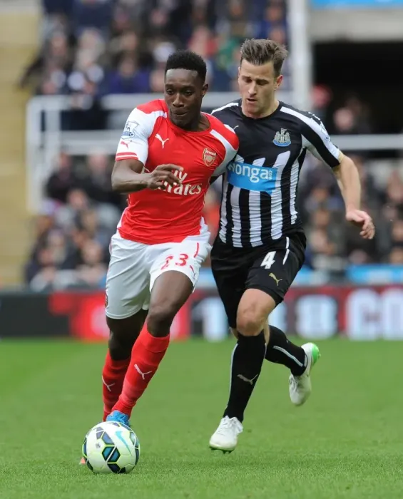 Framed Print : Danny Welbeck vs. Ryan Taylor: Intense Battle in Newcastle United vs. Arsenal Premier League Clash Framed Print : Danny Welbeck vs. Ryan Taylor: Intense Battle in Newcastle United vs. Arsenal Premier League Clash