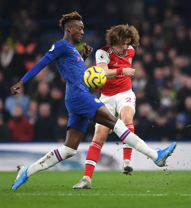 Framed Print : David Luiz Fends Off Abraham: Intense Moment from Chelsea vs. Arsenal Premier League Clash (2019-20)