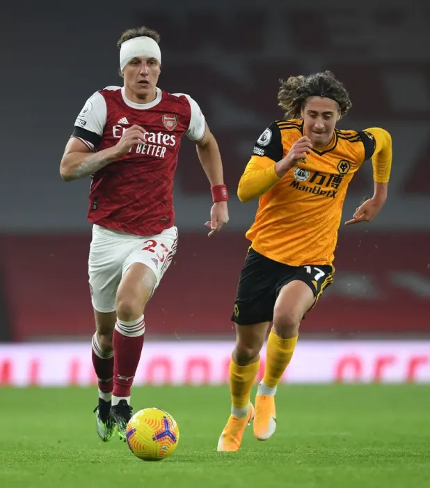 Framed Print : David Luiz vs. Fabio Silva: A Battle at Empty Emirates - Arsenal vs. Wolverhampton Wanderers (Premier League 2020-21) Framed Print : David Luiz vs. Fabio Silva: A Battle at Empty Emirates - Arsenal vs. Wolverhampton Wanderers (Premier League 2020-21)