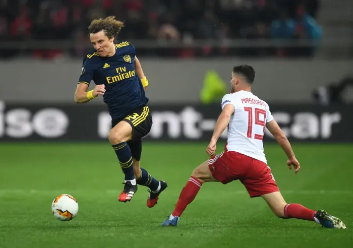Framed Print : David Luiz vs. Giorgos Masouras: Arsenal's Battle in the UEFA Europa League Against Olympiacos