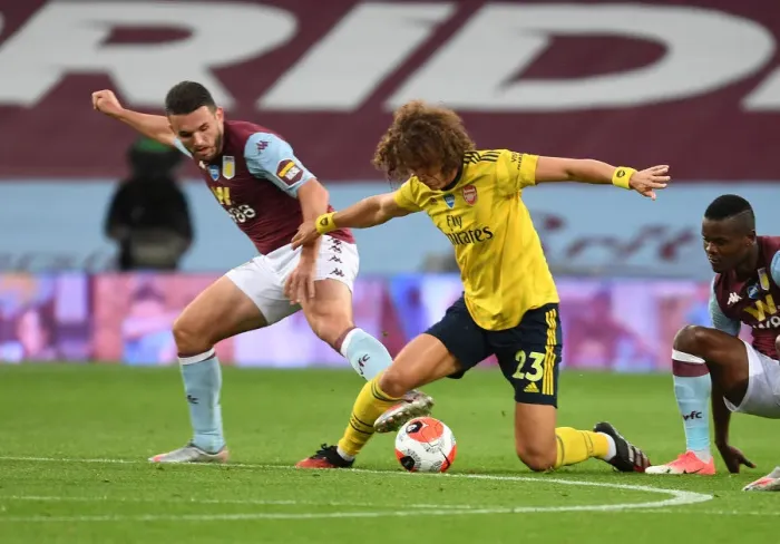 Framed Print : David Luiz vs. John McGinn: Intense Clash Between Aston Villa and Arsenal in Premier League