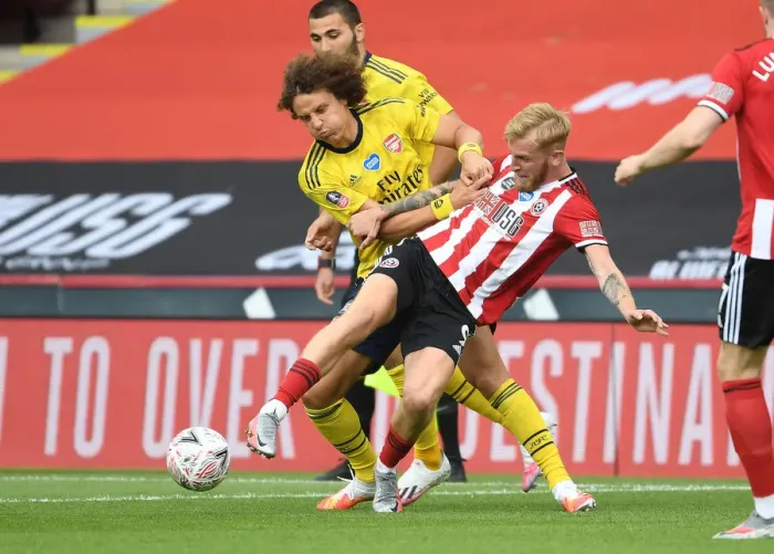 Framed Print : David Luiz vs Olivier McBurnie: A Battle in the FA Cup Quarterfinal Between Sheffield United and Arsenal Framed Print : David Luiz vs Olivier McBurnie: A Battle in the FA Cup Quarterfinal Between Sheffield United and Arsenal