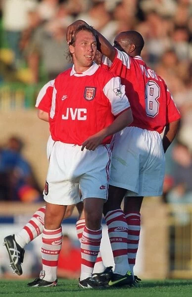 David Platt celebrates scoring his first goal for Arsenal with Ian Wright