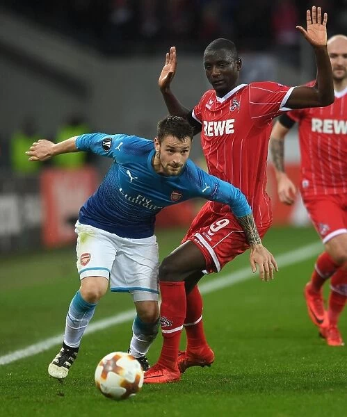 Debuchy vs. Guirassy: Battle in the Europa League between 1. FC Koeln and Arsenal FC
