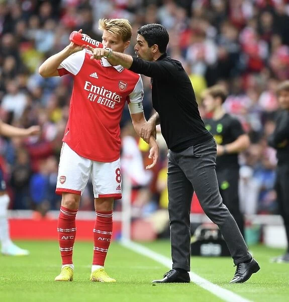Deep in Thought: The Intense Discussion Between Arteta and Odegaard Amidst Arsenal vs. Tottenham Rivalry (2022-23)