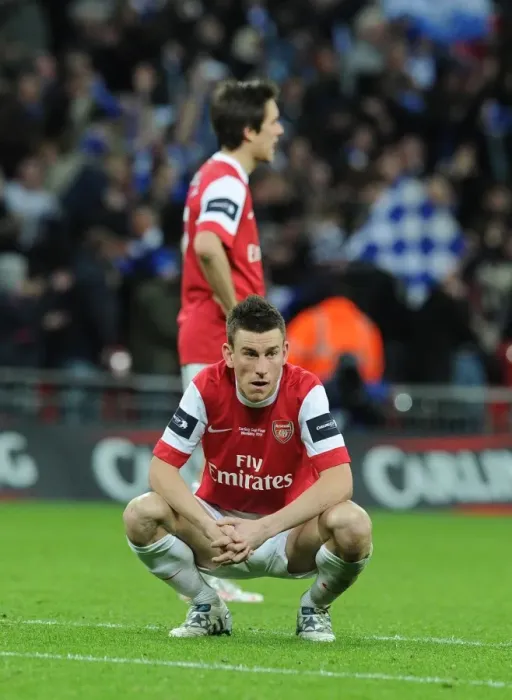 Framed Print : Dejected Arsenal defender Laurent Koscielny. Arsenal 1: 2 Birmingham City