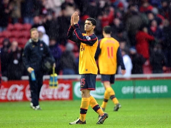 Denilson (Arsenal) claps the fans after the match