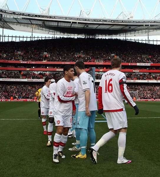 Denilson (Arsenal) shakes hands with Kevin McDonald (Burnley) before the match