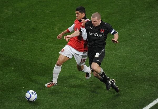 Denilson (Arsenal) Stephen Dawson (Orient). Arsenal 5: 0 Leyton Orient, FA Cup Fifth Round Replay