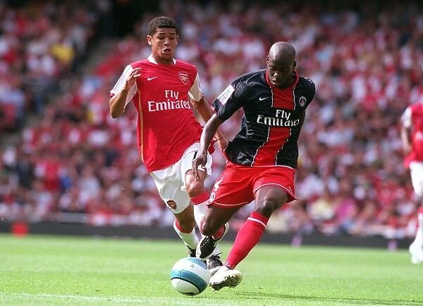 Denilson (Arsenal) Youssuf Mulumbu (PSG)