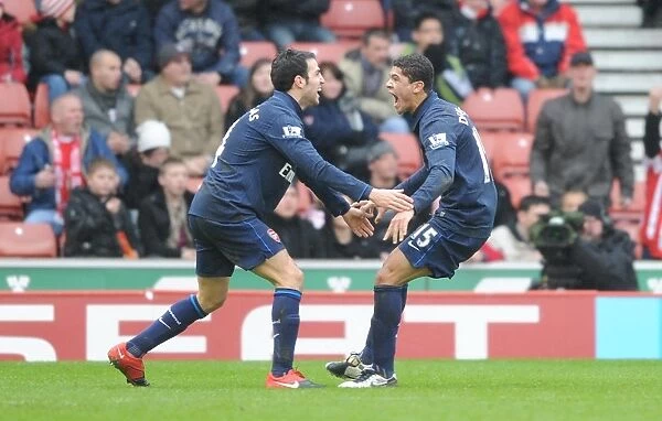 Denilson celebrates scoring the Arsenal goal with Cesc Fabregas. Stoke City 3: 1 Arsenal