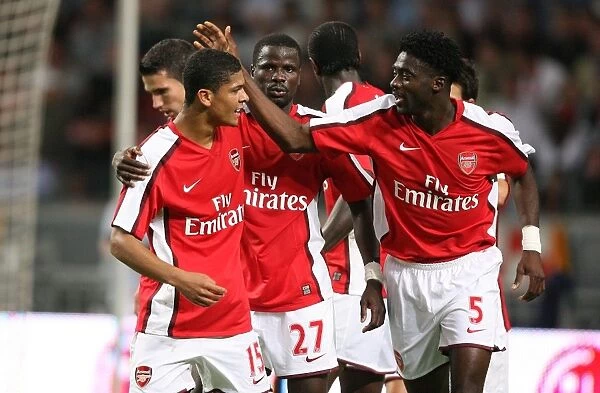 Denilson and Kolo Toure celebrate the 3rd Arsenal goal