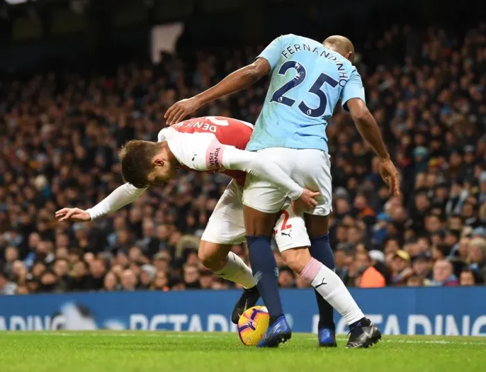 Framed Print : Denis Suarez vs Fernandinho: Intense Battle in Manchester City vs Arsenal FC Premier League Clash