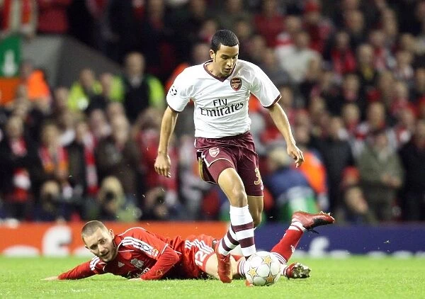 Determined Theo Walcott: Arsenal's Champions League Moment vs. Liverpool - Overcoming Fabio Aurelio to Set Up Adebayor's Goal