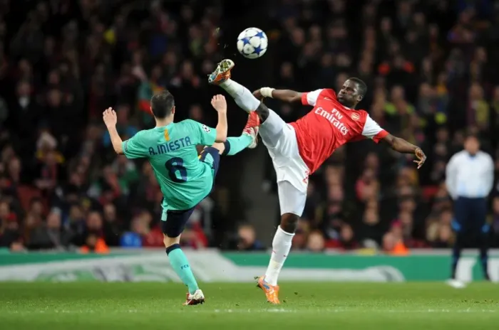 Framed Print : Eboue vs Iniesta: Arsenal's Victory Over Barcelona in the UEFA Champions League (2011)