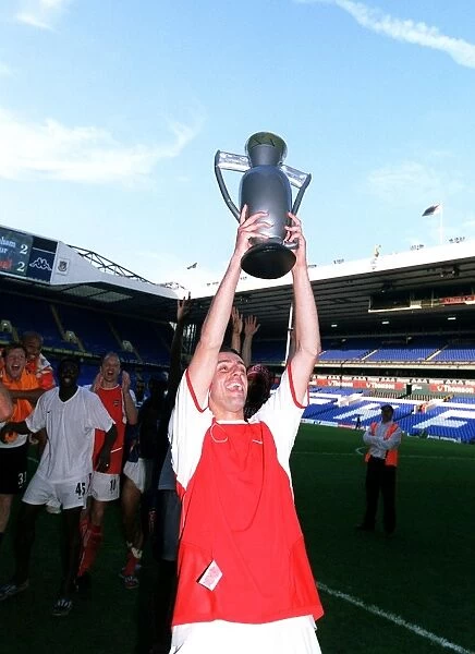 Edu (Arsenal) celebrates winning the League with an inflatable trophy