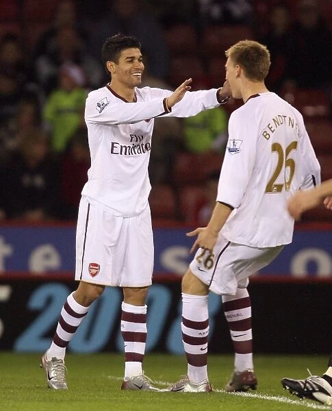 Eduardo celebrates scoring his and Arsenals 1st goal with Nicklas Bendtner