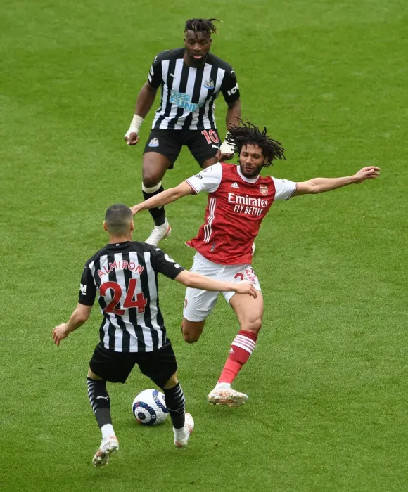 Framed Print : Elneny vs Almiron: A Battle at St. James Park in Empty Stands - Newcastle United vs Arsenal, Premier League 2020-21