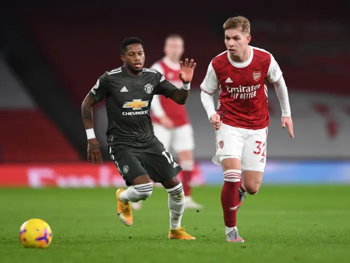 Framed Print : Emile Smith Rowe Stands Firm Against Fred: Arsenal vs Manchester United at Empty Emirates (Premier League 2020-21)