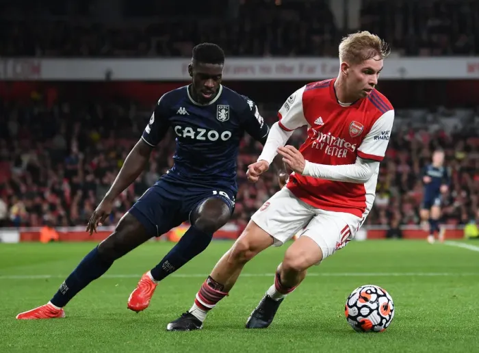 Framed Print : Emile Smith Rowe vs. Axel Tuanzebe: Intense Face-Off in Arsenal vs. Aston Villa Premier League Clash