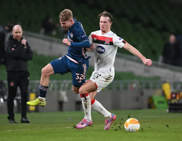 Framed Print : Emile Smith Rowe vs Dan Cleary: Intense Clash in Arsenal's UEFA Europa League Match against Dundalk FC
