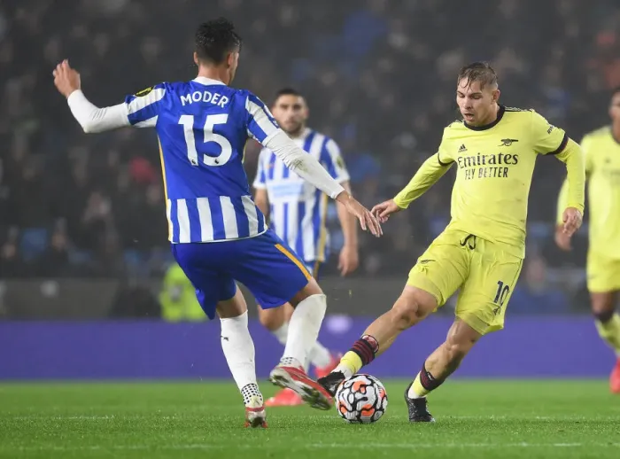 Framed Print : Emile Smith Rowe vs Jakub Moder: Intense Battle in Brighton & Hove Albion vs Arsenal Premier League Clash