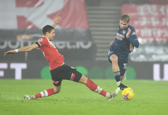 Framed Print : Emile Smith Rowe vs Jan Bednarek: Intense Battle in Empty St. Mary's Stadium - Southampton vs Arsenal, Premier League 2020-21 Framed Print : Emile Smith Rowe vs Jan Bednarek: Intense Battle in Empty St. Mary's Stadium - Southampton vs Arsenal, Premier League 2020-21