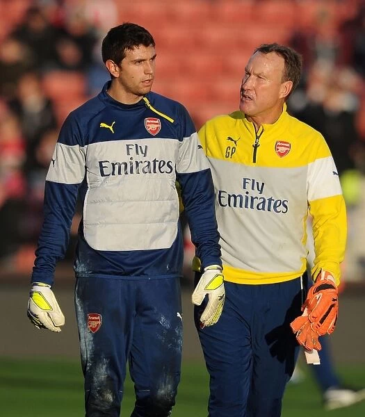 Emiliano Martinez and Gerry Peyton: Arsenal's Goalkeeping Duo Prepare for Stoke City Clash (December 2014)