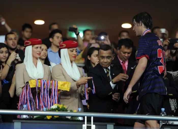 Framed Print : Emirates cabin crew help with the post match presentation. Malaysia 1: 2 Arsenal