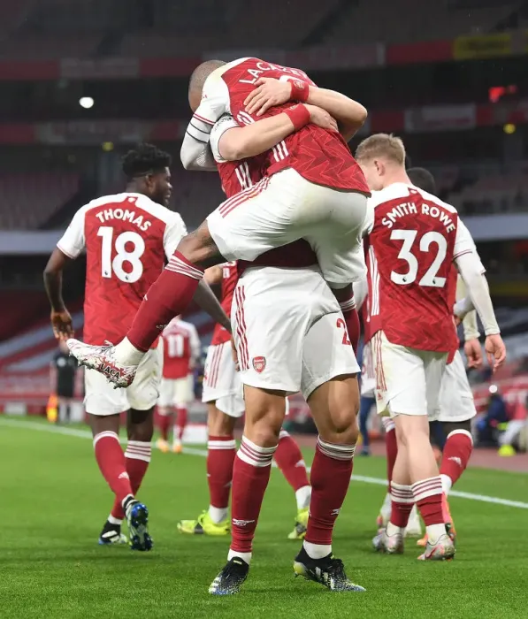 Framed Print : Empty Emirates: Lacazette and Luiz Celebrate Arsenal's Victory Over Tottenham (2020-21)