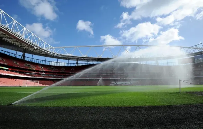 Framed Print : Emirates Stadium pitch is watered before the match. Arsenal 2: 0 Everton. Barclays Premier League